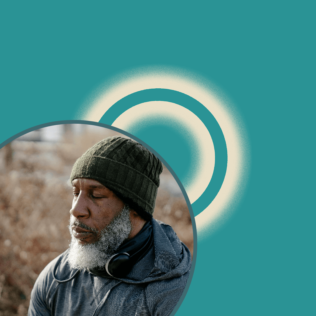 A man with a gray beard wearing a knit hat and headphones rests his eyes outdoors; a teal background with two illuminated rings is shown behind him in a circular frame.